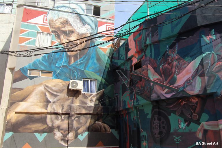 Artists paint mural in Buenos Aires at Villa Fraga BA Street Art